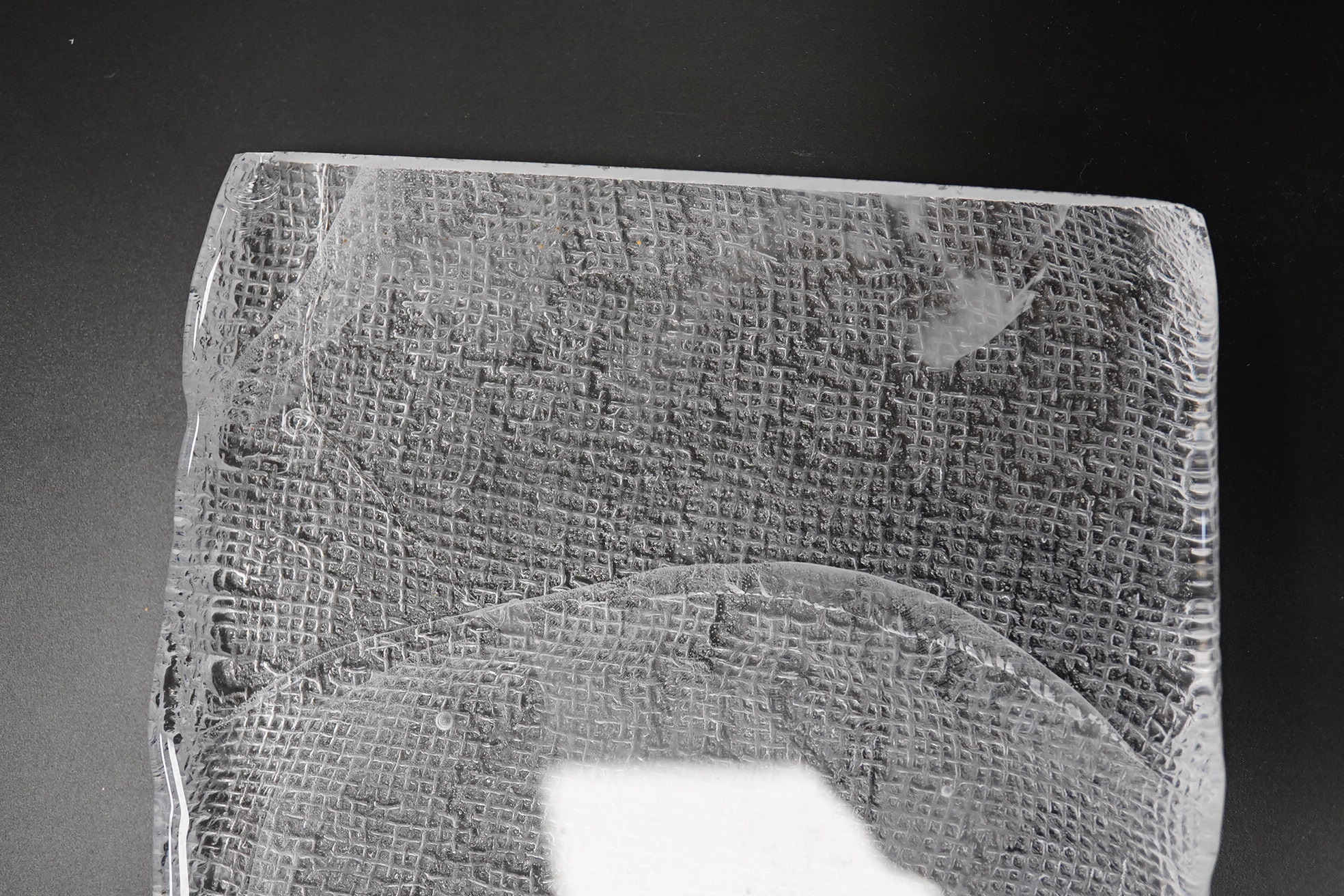 A Mary Canny art glass sandblasted hessian textured glass sculpture, 42cm x 16cm